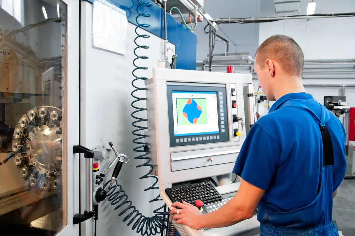 Operator at an equipment control panel